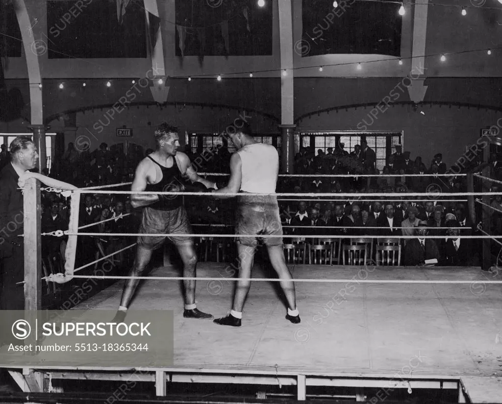 Phil Scott Getting Ready For Stribling - Phil Scott sparring with a Don Shortland in the Pier Pavilion at Herne Bay, in preparation for his fight with Young Stribling. Spectators attempt his practice the money going to charities. September 11, 1930. (Photo by Central Press Photograph).