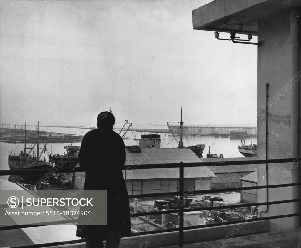 Tunis (Second of Nine) -- From the rooftop of the Port Control building a watcher gazes down on the large modern port of Tunis which is accessible to ocean-going vessels. The strategic location of Tunisia across a small channel south of Sicily permits a careful which over all shipping plying between the Suez Canal and Gibraltar. February 29, 1952. (Photo by United Press).