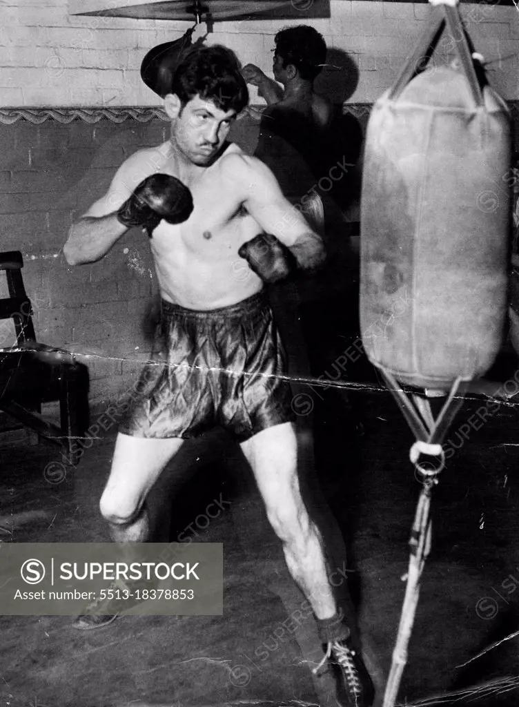 Only the punching bag lasted more than three rounds  while Johnson trained for his first five Sydney fights. None of his opponents did. Don Johnson has been the year's sensation at the Sydney Stadium. He looks peaceful chap but don't be misled. He's tough in the ring. November 22, 1950.