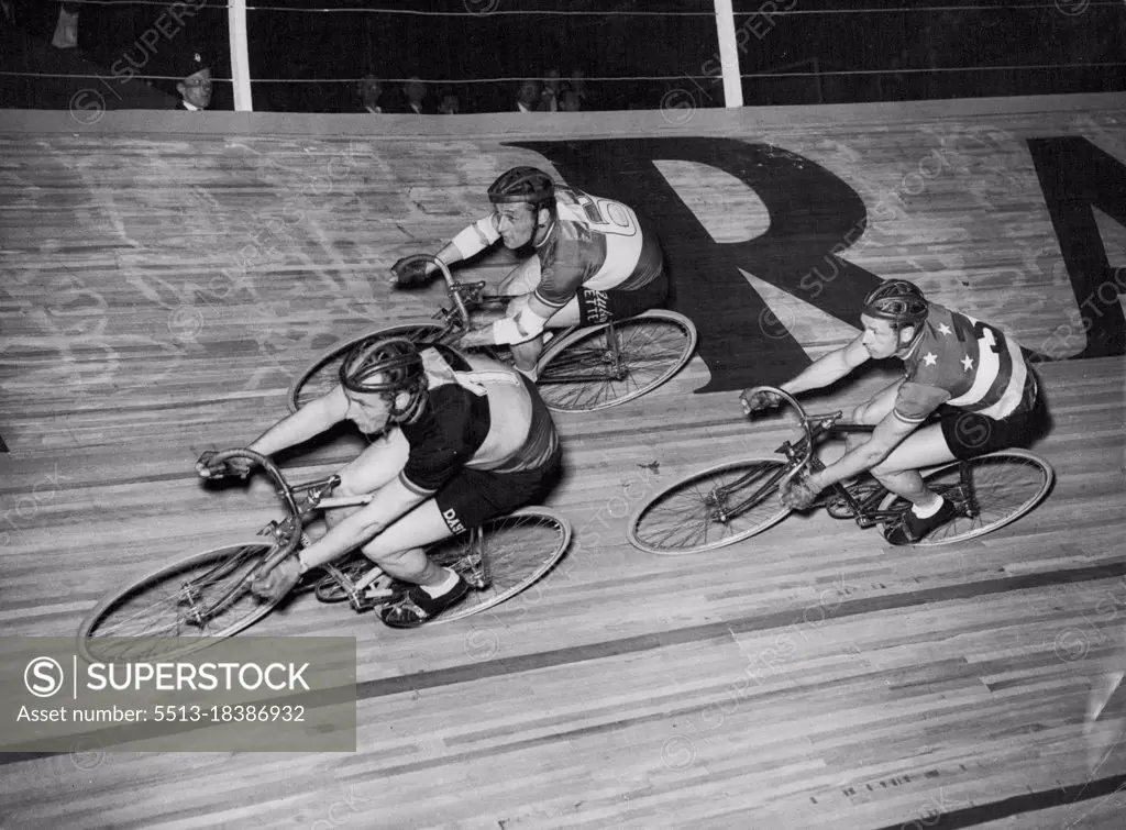 They Will Ride For Six Days -- Three of the riders in the international six-days cycle race at the Empire Pool, Wembley, early this morning. They are (left to right); Albert Bruylandt (Belgium); Ferdinando Terruzzi (Italy) and Alfred Strom (Australia).Film star Diana Dors started the £8,000 international six-days cycle race at the Empire pool, Wembley, at midnight (Sunday). There were 24 starters in this marathon, and by the time it ends on Saturday they will have covered over 1,600 miles. May 19, 1952. (Photo by Reuterphoto).