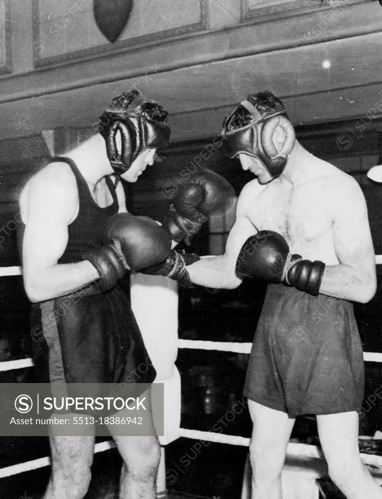 Strickland Prepares To Meet Loughran -- Maurice Strickland, the New Zealand champion (left) photographed sparring with Jeff Wilson, at the Stadium Club today. Strickland meets Tommy Loughran at Wembley next Tuesday. November 05, 1935. (Photo by Keystone).