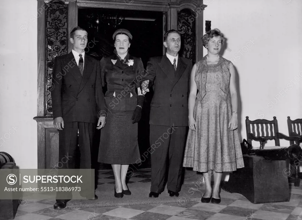 The Prime Minister of South Africa And His Family -- Mr. Johannes Gerhardus (Strydom), Prime Minister of South Africa, with his wife, son Gerhardus (left), and daughter Estelle (right), on the 'stoep' (verandah) of Groot Schuur, the Prime Minister's residence in Cape Town, originally built for Cocil Rhodes. - Gerhardus is at school in Pretoria and Estelle is a student at Stellenbosch University. January 19, 1955. (Photo by Neville Clayton, Camera Press).