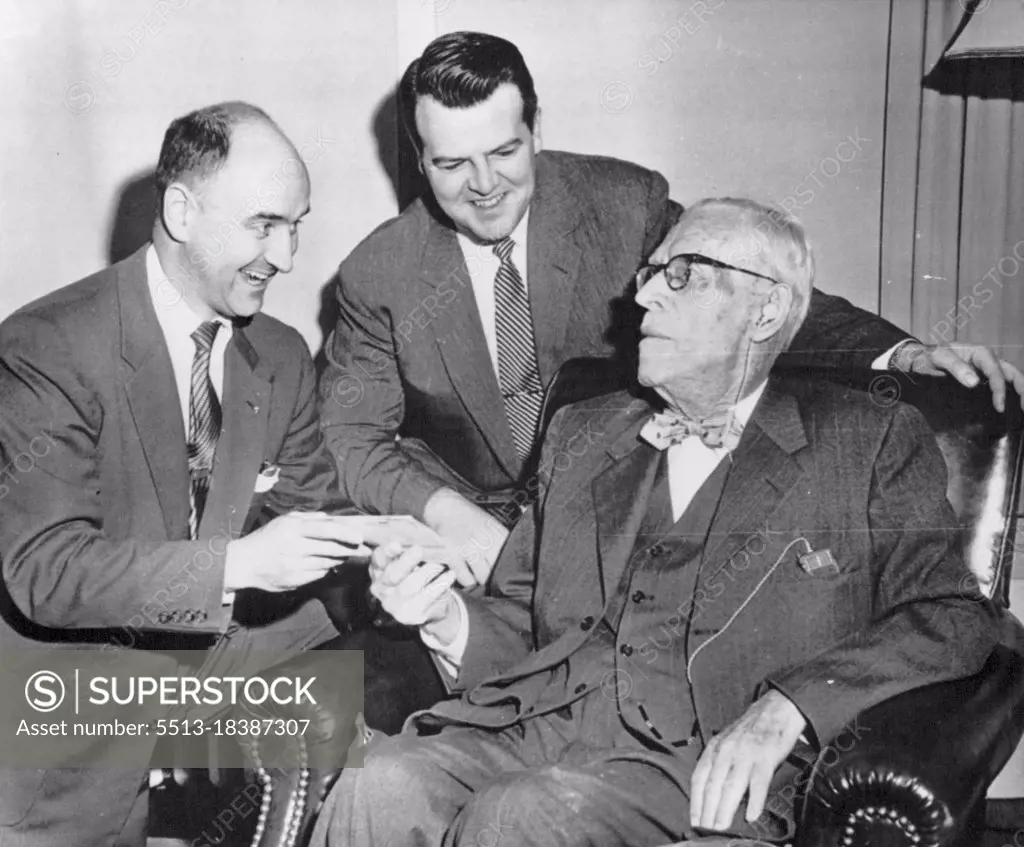 Outlives Insurance Policy -- William S. Spellman, seated, father of Francis Cardinal Spellman, receives a check representing full payment on his life insurance policy from Edward Livingston (left) and Charles H. Kerrigan, Union Central Life Insurance Co., representatives, here today. Insurance officials said the 96-year-old man has outlived the policy which happens only one time in 100,000. The amount of the check is several thousand dollars. November 15, 1954. (Photo by AP Wirephoto).