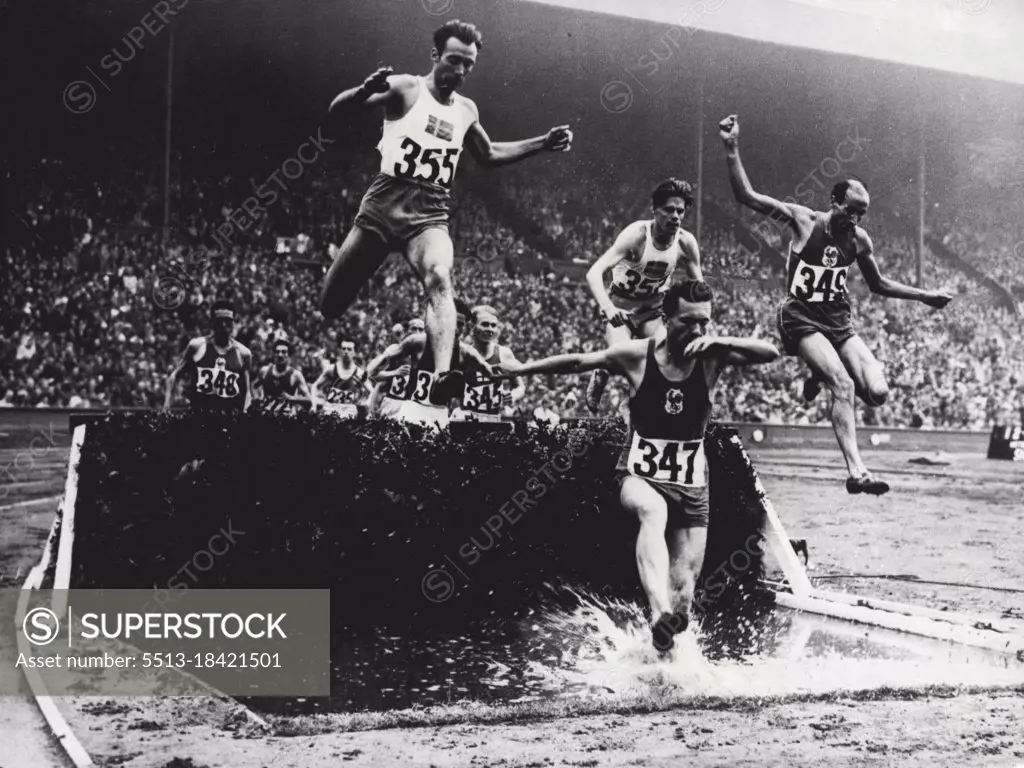 XIV Olympiad - Swedes Sweep Board In 3,000 Metres Steeplechase : 3,000 Metre Steeplechase competitors taking water jump at Wembley Aug 5. seen in picture are E. Elmsaeter of Sweden (355); M. Chesneau of France (347);  R. Pujazon of France (349) T. Sjoestrand of Sweden (357); P.V. Siltaloppi of Finland (345) and A. Cuyodo of France (348).The Olympic 3,000 metres steeplechase at Wembley Aug. 5 was won by Thure Sjoestrand of Sweden in 9 min 4.6 secs; with E. Elmsaeter of Sweden second and G. Hagstroem, also of Sweden, third. August 20, 1948. (Photo by The Associated Press Ltd.)