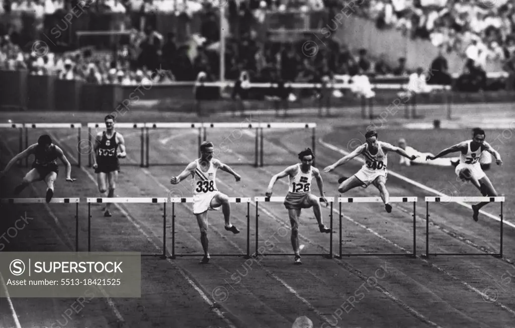 Olympic games 1948 - Athletics - R. Larsson (No. 128) taking the last hurdle in the 400-metre semi-final in which he set up an Olympic record of 51.9 secs. R. Ault, U.S.A., (No. 338) was second. July 30, 1948.