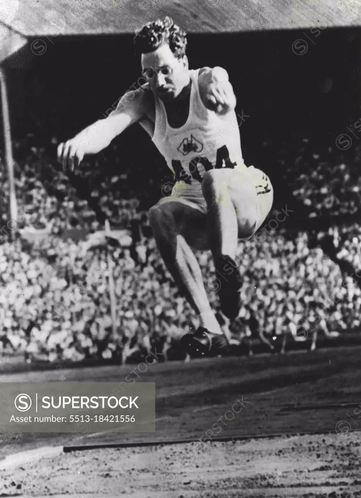 Australian In Olympic Final : Australia's T. Bruce (404) competing in the final of the Long Jump at the Wembley Stadium. July 31, 1948. (Photo by OPA Photo).