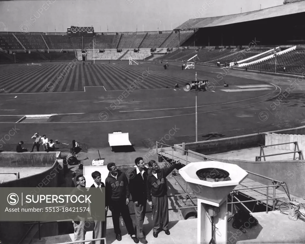 Americans View Wembley Stadium: London's Wembley Stadium, venue for the Olympic Games, looks in first-class order today, July 27, two days before the opening of the Great meeting. Today Athletes were allowed to inspect the stadium for the first time, and here, looking at the platform from which the Olympic fire will flame throughout the games, are left to right, Malvin C. Whitfield (400 and 800 metres), from Bay City, Texas, A. Richmond Morcum (Pole Vault), from Portsmouth, New Hampshire, Vern V. Mcgrew (high Jump), from Houston, Texas, and Leroy Braxton Cochran (400 metres hurdles), from Long Beach California. July 27, 1948. (Photo by Associated Press Photo).