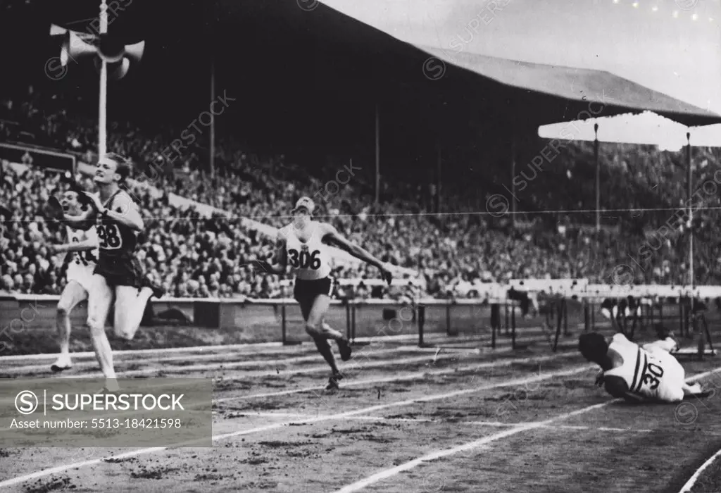 Olympic Games: Marie (France) first, Bernard of Switzerland, second, and Foster (Jamaica) third, in heat 5 of 110 metre hurdles at Wembley, to-day (Tuesday). D. Finlay of Britain falling at the last hurdle, just before the tape, was leading until his accident. August 03, 1948. (Photo by Olympic Photo Association).