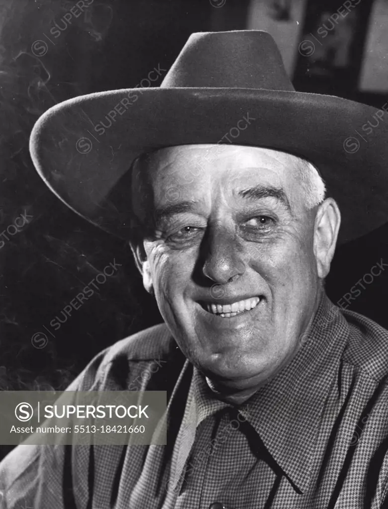 With the smile of a man whose dream has come true, William Walkley wore this red hat in Sydney's Martin Place on the day the Western Australian oil strike was announced.  January 13, 1954.