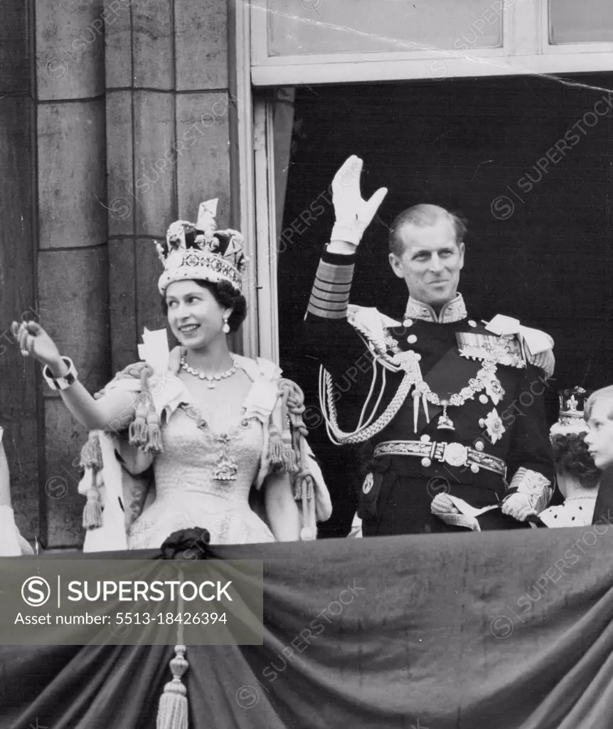 Her Happiest Day - One of the happiest picture of a happy day - the Queen, wearing the Imperial State Crown, and the Duke Edinburgh, in uniform of Admiral of the Fleet, smile and wave. From the balcony to the milling crowds pressing around the gates of Buckingham Palace after the coronation to-day (Tuesday). June 02, 1953. (Photo by Reuterphoto).