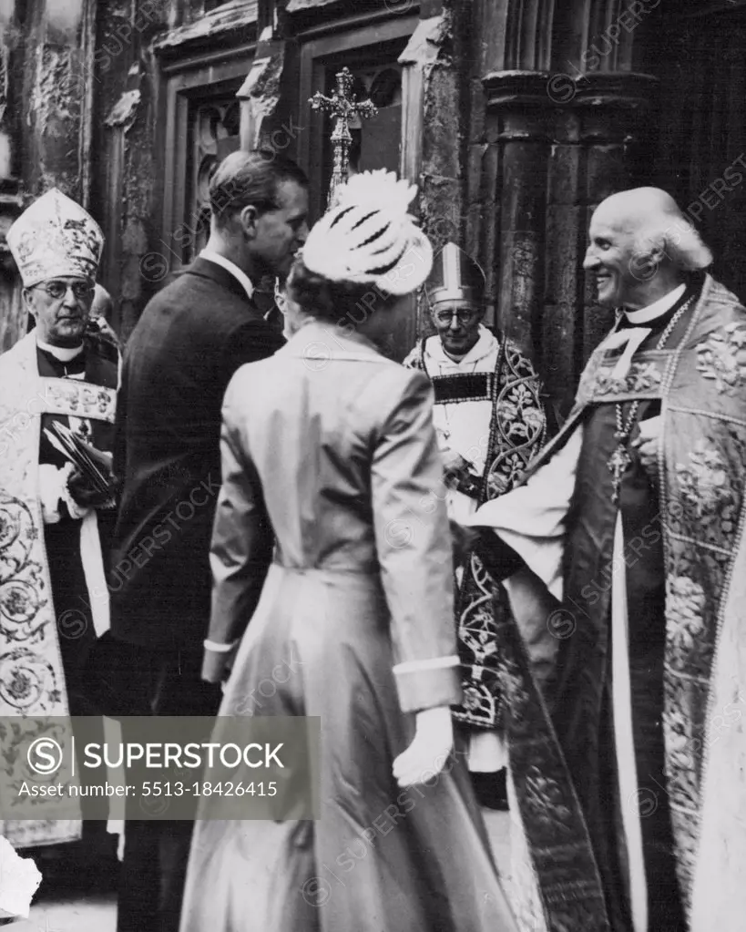 The Duke Meets the Dean -- The Very Rev, Hewlett Johnson, Dean of Canterbury, (right) receives Prince Philip at the West Door of Canterbury Cathedral, Kent, when he and Princess Elizabeth attended a service for the Kent Country playing fields Association, July 31. Prince Philip is President of the playing fields association of Great Britain. He and Princess Elizabeth were spending the week with lord and Lady Brabourne at Mersham Le watch Kent. August 12, 1949. (Photo by Associated Press Photo).