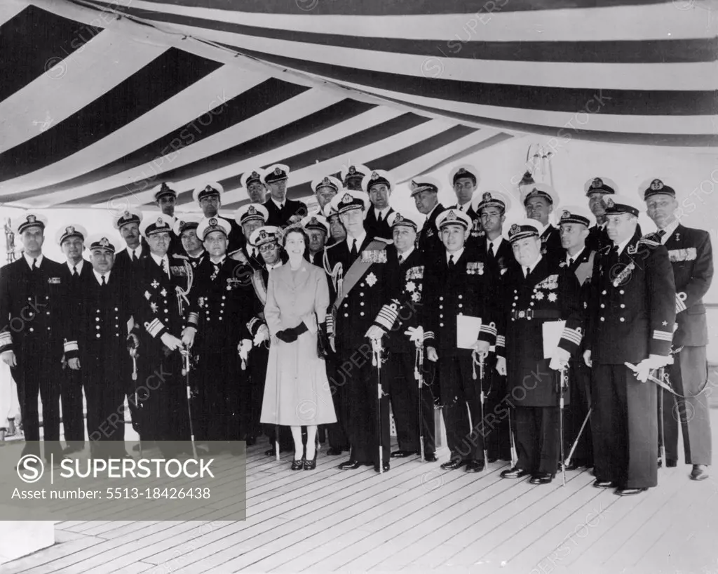 The Queen Receives Naval Officers Aboard The Royal Yacht -- H.M. The Queen and H. R. H. the Duke of Edinburgh with foreign Naval Officers aboard H.M.S. surprise this afternoon. Aboard the Royal Yacht (H.M.S. Surprise) today, H.M. The Queen received Senior officers of the Royal Navy, Flag and Commanding Officers of dominion Navies, Officers Commanding ships of foreign Navies and Officers of British Merchant Ships and Trawlers, taking part in the Coronation Naval Review at Spithead. June 15, 1953. (Photo by Fox Photos).