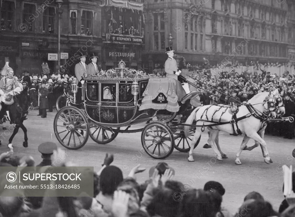 Princess Elizabeth Marries in Westminster Abbey Crowed London Cheers Royal Bride -- Princess Elizabeth and the King arriving at Westminster Abbey in the Irish State Coach. Princess Elizabeth, dressed in a wonderful gown of heavy ivory slipper satin embroidered with thousands of pearls, drove through massed, cheering London crowds to be married in Westminster Abbey to the Duke of Edinburgh, the former Lieutenant Philip Mountbatten The Princess, accompanied by the King, drove to the Abbey in the Irish Coach with a Sovereign's escort of Household Cavalry, in Colourful full dress. Proceeding her in the procession were the Queen, Queen Mary and members of the Royal families of Europe. Lieutenant Philip received the titles of Duke of Edinburgh, Earl of Merioneth, and Baron Greenwich from the King at a riding eve ceremony in Buckingham Palace. November 20, 1947. 