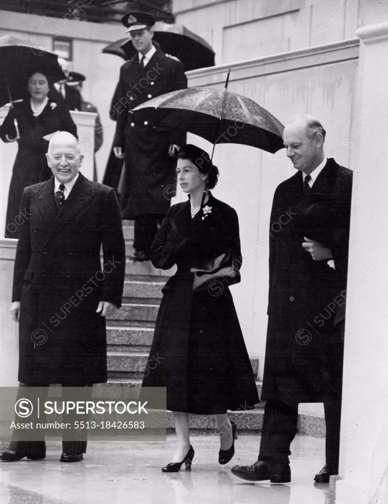 The Queen Unveils Statue Of King Geoege VI -- The Queen photographed at the unveiling ceremony today. In pouring rain the Queen today unveiled the National Memorial to her father, King George VI, in Carlton Gardens overlooking the Mall. She was accompanied by the Duke of Edinburgh. Also present at the ceremony were the Queen Mother, Princess Margaret, the Duke and Duchess of Gloucester, the Duchess of Kent, and members of the Government and members of Parliament. October 21, 1955. (Photo by Daily Mirror).