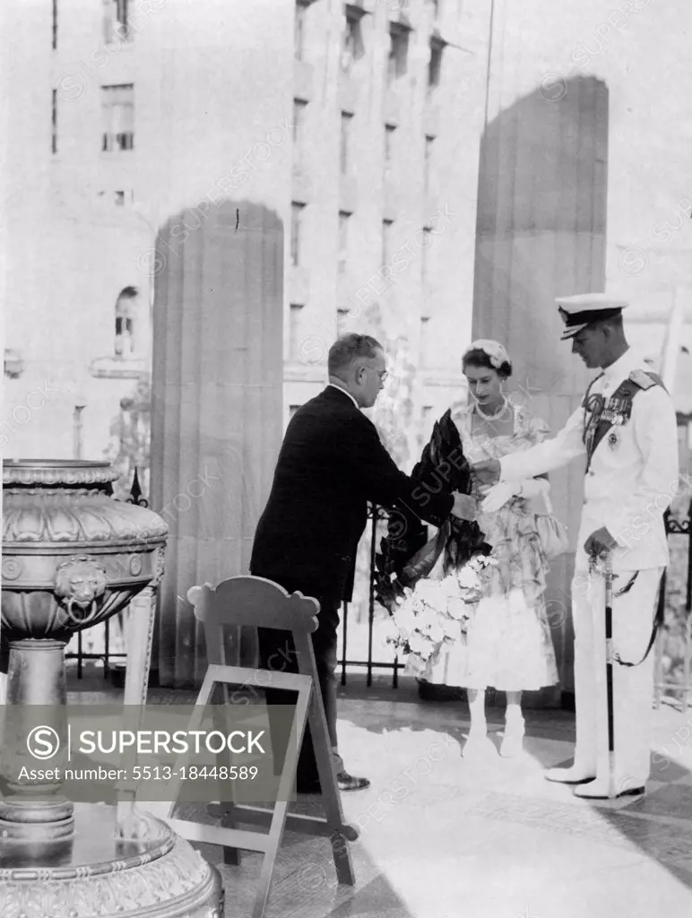 It was a solemn moment for the Queen as she placed a wreath on the Shrine of Remembrance. March 19, 1954.