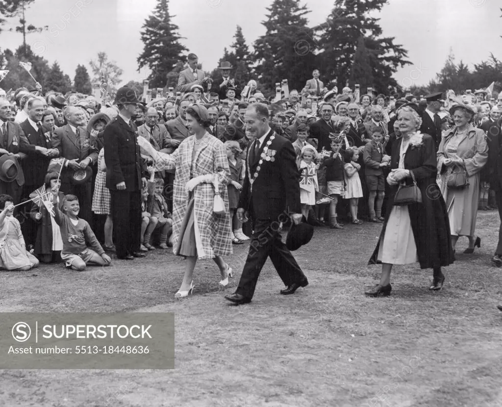 Queen Elizabeth with Mayor E. G. Coddington at a Civic Reception at Masterton, in the Wellington Province of New Zealand. After their visit to Masterton, the Royal Party left the North Island of the Dominion and flew to Blenheim, where the tour of the South Island begins. The Queen will leave New Zealand on 30th January, embarking on the Gothic at Fluff, for the trip to Sydney. January 20, 1954.