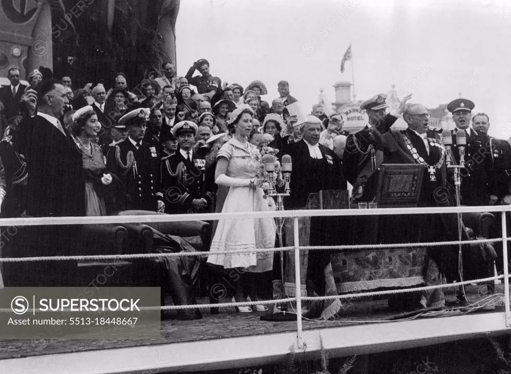 The Prime Minister of New Zealand, Mr. S. G. Holland (waving hand) leads three cheers for the Queen. December 31, 1953.