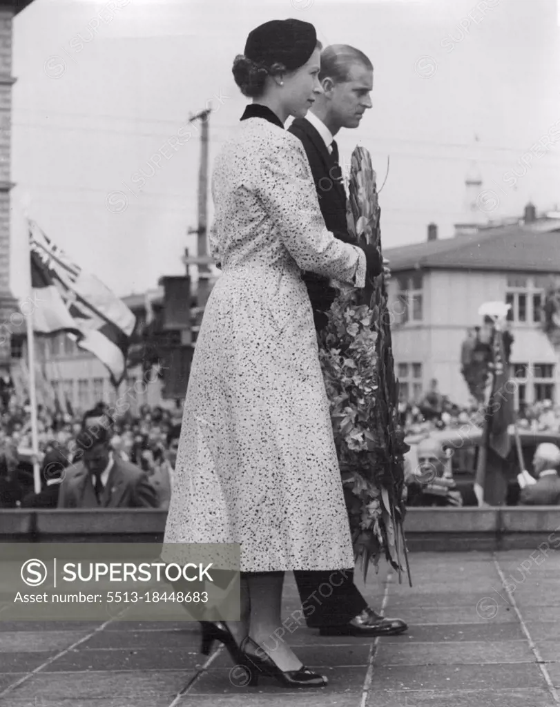 Queen and Duke of Edinburgh laying a wreath on the War Memorial shortly after their arrival in Wellington, New Zealand. January 14, 1954.