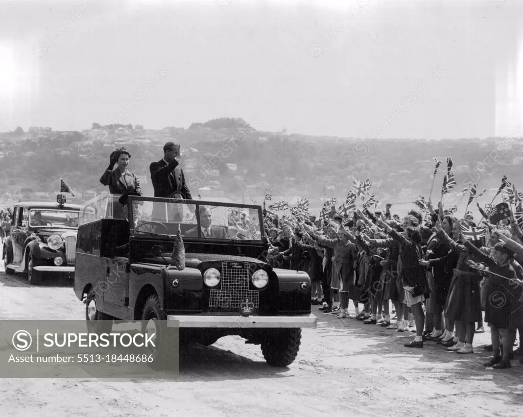 Queen Elizabeth and Duke of Edinburgh waving to children in Forbury Park, Dunedin, NZ. February 04, 1954.