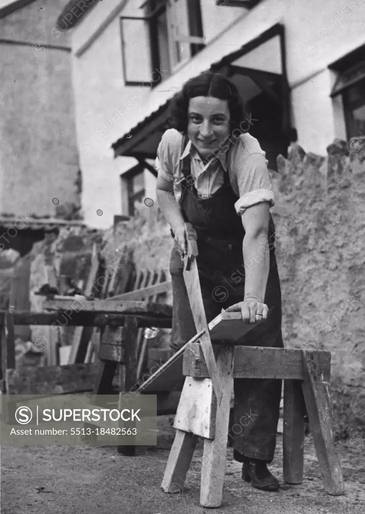 "The Right-Hand Woman" - Mrs. Farmaner sawing out wood as a carpenter. Mrs. Farmaner aged 28, two years ago was evacuated with her two children to Idford near Newton Abbot. She found time hanging on her hands, so tried her hand at gardening, with very pleasing results. She then told the local builder that she would like to help with building and repairs to country property; he gave her a trial, and she is now the right hand woman, of Mr. G. Hamilton to the village builder at Idford. September 2, 1942. (Photo by London News Agency Photos Ltd.).