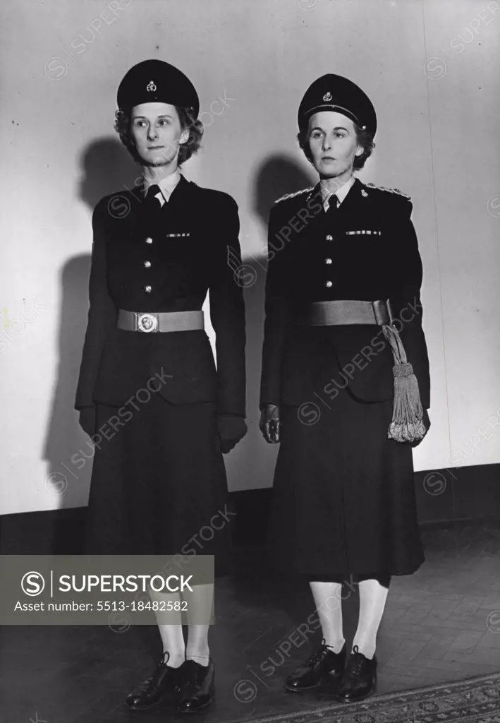 "On (Fashion) Parade" WRACS Get New Uniforms - Contrasting the officers and other ranks new uniforms are Junior Cmmdr. Partridge, WRAC. and SGT. E.Wright, in their ceremonial dress. Beret is worn for walking out, for other ranks. Members of the Women's Royal Army Corps and the Queen Alexandra's Royal Army Nursing Corps will soon be wearing the nor walking out and ceremonial uniforms, which have been under discussion for nearly three years. New dress has been approved by the king,and details, which were a close secret, hair now been released. November 4, 1949. (Photo by Fox Photos).