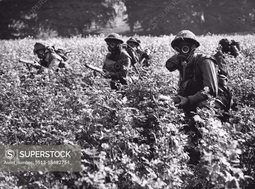 Biggest Army Maneuvers Begin -- The biggest Army maneuvers to be held in this country began early this morning. Known as exercise "Surprise Packet", it will involve 50,000 troops and 12,000 vehicles, and Territorials, and is spread over an area embracing Somerset, Dorset, Wilts, Berks, Hants, Oxford, Bucks and Surrey. This picture shows men of the Highland Light Infantry in action during a gas attack. October 12, 1951.  