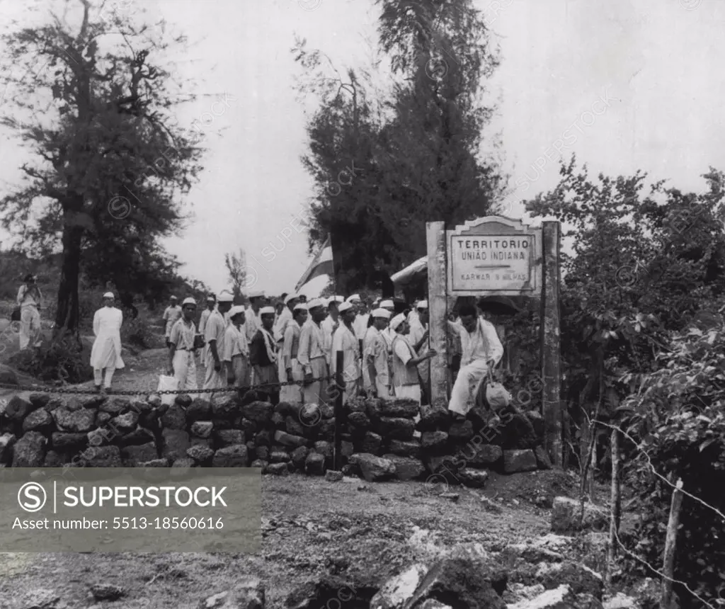 Liberation Army, Crosses Goan Border -- Anthony Desouse, 25-year-old former Bombay clerk turned agitator, climbs over stone barrier marking the India-Goa border as he leads a group of supporters into Portuguese territory on India's Independence Day last Sunday. The group, supporting the Indian campaign to merge the Portuguese enclaves in India into Indian territory, was arrested after marching several miles past the frontier. August 21, 1954. (Photo by AP Wirephoto).