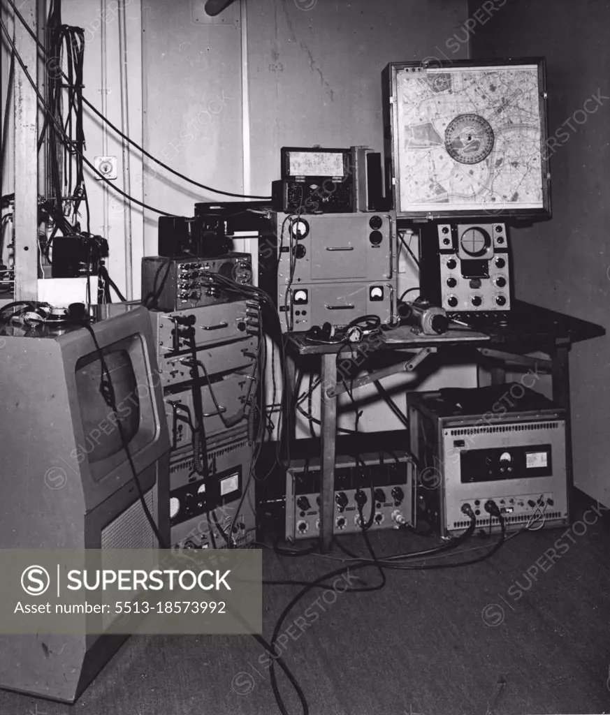 "Roving Eye" Receiving Terminal.Left to right are the picture monitor; sound receiving and communication equipment; vision receiver (on table), communication transmitter and aerial direction indicator on top of picture wave form monitor. October 15, 1954. (Photo by BBC Television Service).