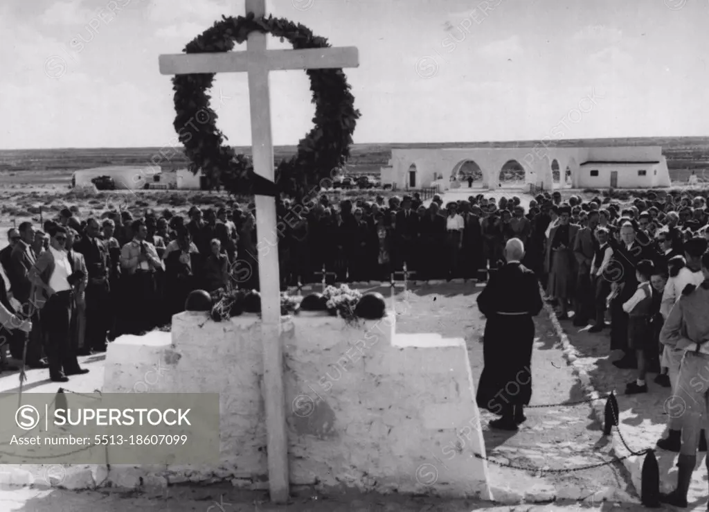 German-Italian Remembrance Day In Alamein -- A German priest officiating at the German-Italian cemetery at Tel-el-Eyssa, in Alamein, on the German Remembrance Day.Members of the German colony in Egypt stand around him as they take part in the service. November 19, 1952. 