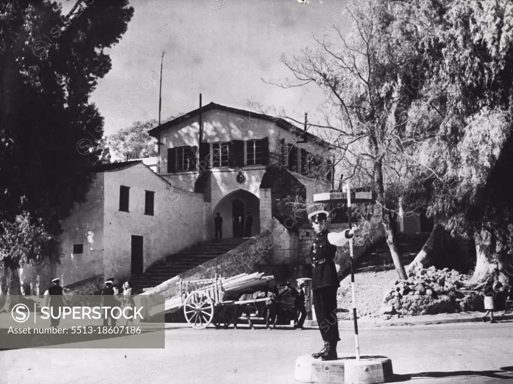 Headquarters Of The Cyprus Police -- The Cyprus Police Force has its H.Q. near the Paphas Gate in Nicosia, where the road is cut through the ancient city walls. A police constable directs the traffic from a control point in front of the building. October 19, 1955. (Photo by Camera Press).