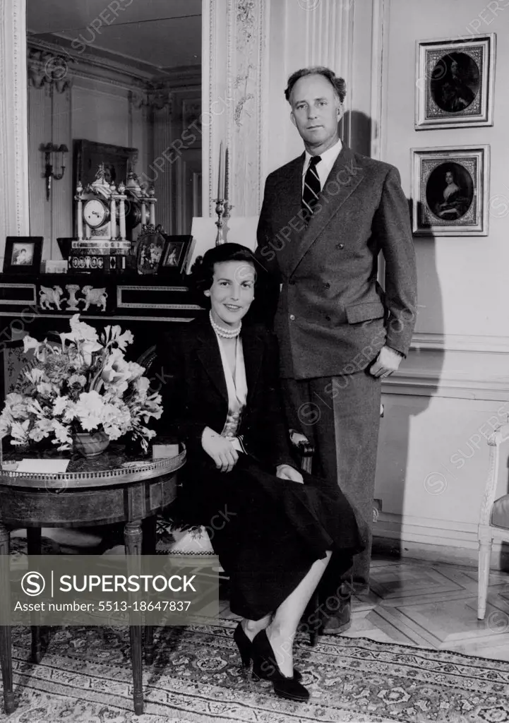 A King in Waiting Leopold: Will he Return Geneva: In a Luxuriously - furnished room of their villa at Pregny, King Leopold of the Belgians and his attractive dark-haired wife, the Princess De Rethy, pose for the cameramen. June 25, 1950. 