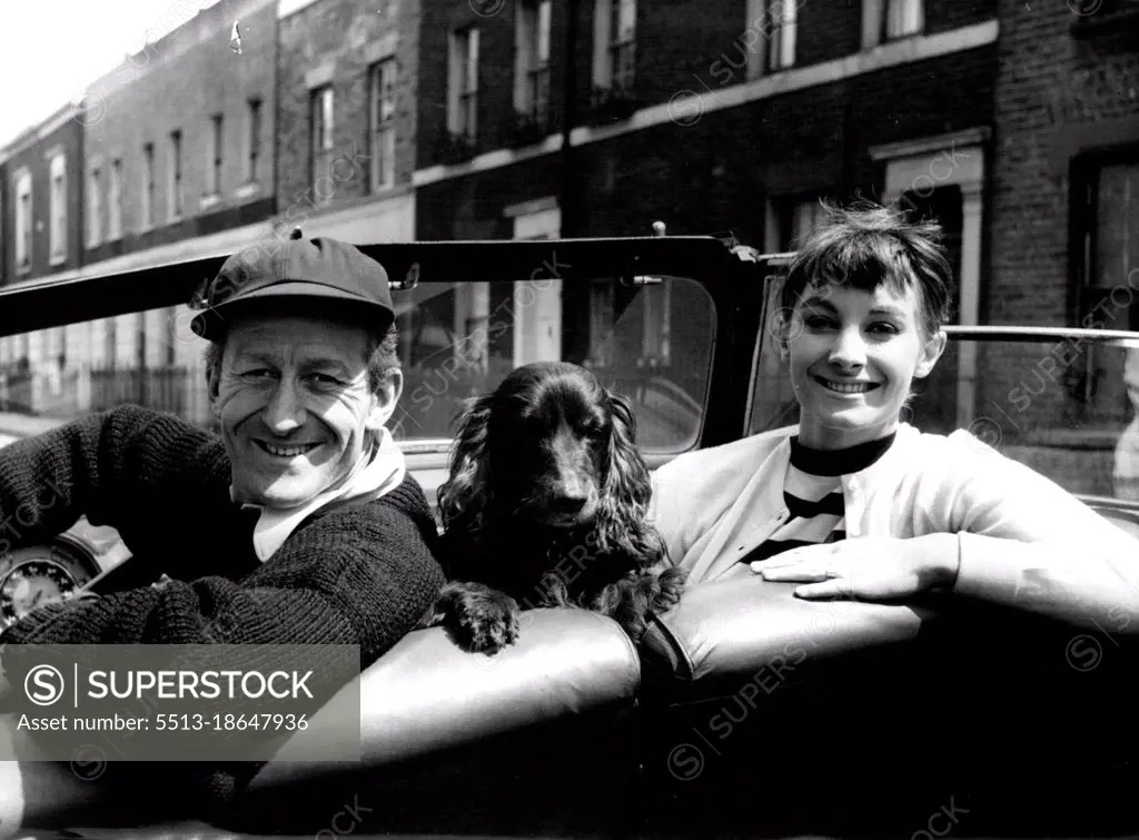 Jon Pertwee And His Wife, Jean Marsh -- Comedian Jon Pertwee photographed with his wife, actress Jean Marsh. Between them in the car is their pet spaniel, known as "The Pot". Jon is the brother of playwright Michael Pertwee; their father is Boland Pertwee, dramatist, novelist and short-story writer. November 01, 1955. (Photo by Tom Blau, Camera Press).