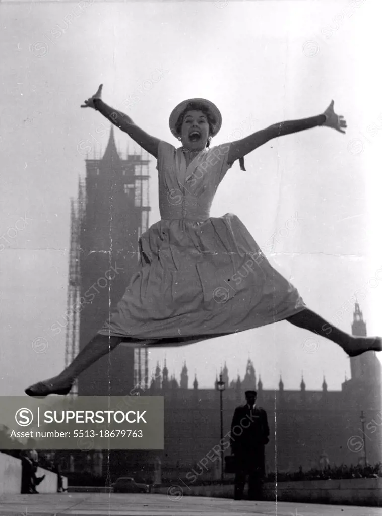 Actress and singer Louie Ramsay, 25, who usually has to play "glamour girl" parts in  her stage shows, is jumping for joy - because in her new London musical she plays the part of an "ordinary" girl. She is a typist who catches the 7.27 train to the city every week-day morning. Louis says: "I was a bit tired of being one of the easy on the eye types. Being ordinary is fun". May 27, 1955.