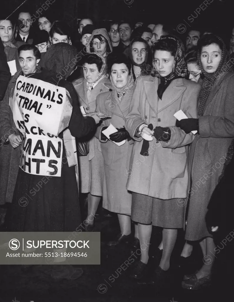 Catholics Protest Against Cardinal's Arrest - Pamphlets being distributed among the crows outside who were unable to secure admission to the rally this evening. British Roman Catholics from all parts of the country flocked to the Albert Hall, London, this evening (Mon) for a mass rally held in protest against the arrest of Cardinal Mindazenty, Primate of Hungary, who is accused of treason, espionage and black market currency dealings. The Cardinal made a last appeal before the Budapest People's Court, where he is on trail, on Saturday, and the verdict is to be announced to-morrow (Tues). February 7, 1949. (Photo by Reuterphoto).