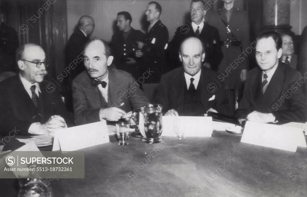 Judges Who Will Try Nazi War Criminals -- The four judges of the international war crimes Tribunal, Set up to Judge 24 Germans -- Members of Adolf Hitler's Nazi Hierarchy -- at Nuremberg on charges of crimes against humanity and world peace, sit together at their first meeting in Berlin. Left to right, they are: M. Donnedieu de Vabres, France; Francis J. Biddle, United States; Lord Justice Lawrence, Great Britain, and Maj. Gen. I. J. Nikitcenko, U.S.S.R. Formal indictments against the Nazis are expected to be handed down *****. October 15, 1945. (Photo by AP wirephoto).