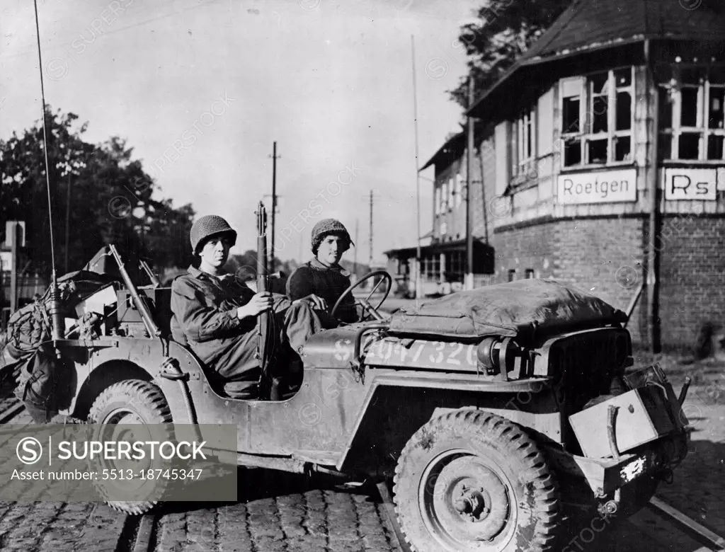 Americans Pierce Siegfried Line In Roetgen AreaThe first American Jeep to cross the German frontier stops at the Railroad Station in Roetgen September 14, 1944. American forces blasted a path through the outer concrete and steel fortifications of the Siegfried line in the vicinity of the German City a few miles inside the border. October 23, 1944. (Photo by Office of War Information).