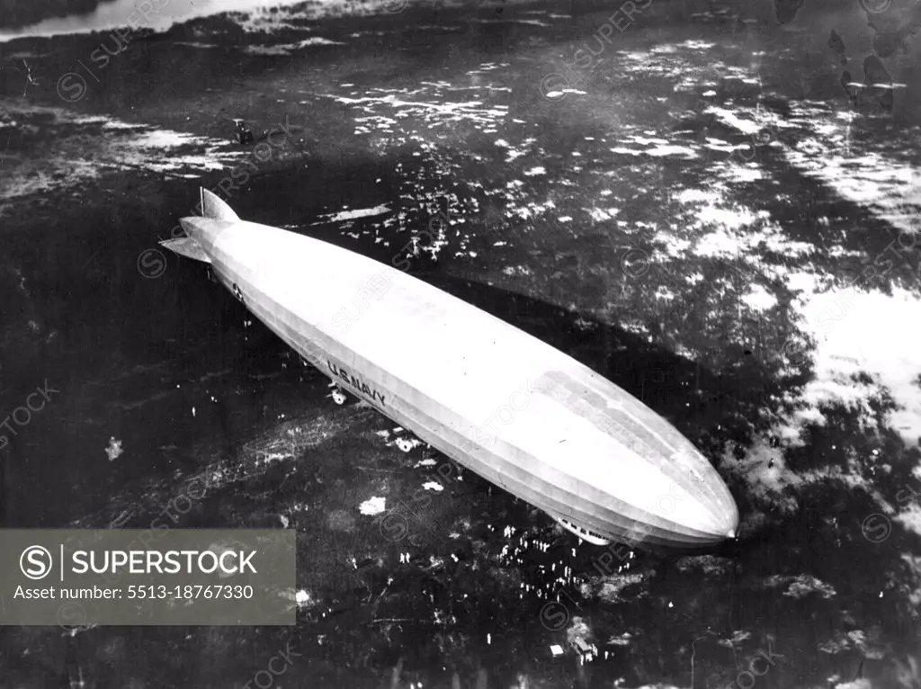 Exclusive photo of Dirigible "Los Angeles" at end of long flight to Canal -- An exclusive aerial view of the U.S. Navy Dirigible "Los Angeles" as she appeared moored to her secret base on a fortified Island near balboa. The Island guards the Pacific entrance to the Panama Canal. The Dirigible was photographed at the completion of her long flight from Lakehurst, N.J. Since her arrival here the Los Angeles has been "Concealed" by the navy as a part of the war manoeuvres in which she is to play an important part. February 14, 1931. (Photo by International Newsreel Photo).