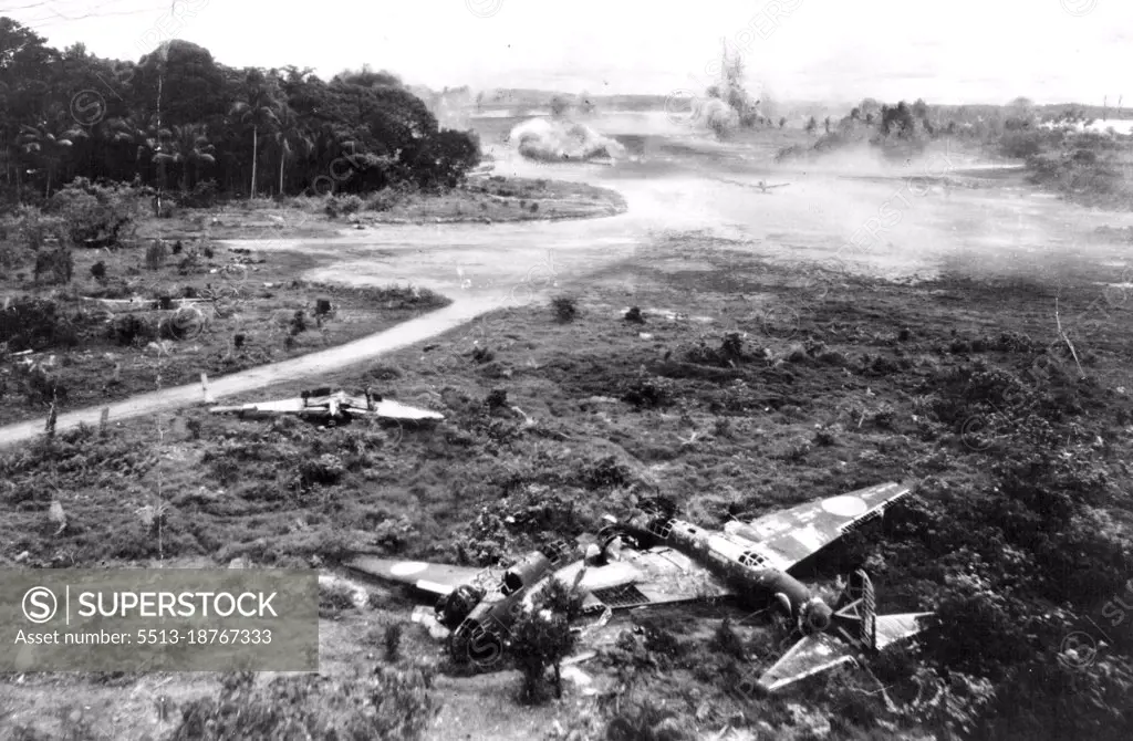 Fifth Japanese Planes Destroyed -- In a swift, devastating strike by U.S. Fifth Air Force bombers this last effective Nip air base in New Guinea recently was badly dam­aged. The location is Jefman airdrome, Sorong Island, where 50 Japanese planes were destroyed both on the ground and in the air. In this photo two Nip planes are seen destroyed on the ground while a third rises to a sudden, fiery end in the air. When the U.S. bombers had finished their work, not a serviceable Jap plane remained on the ground. Note the delayed bomb being parachuted to the ground right on the tail of the Jap bomber. June 24, 1944. (Photo by USA Fifth Air Force).