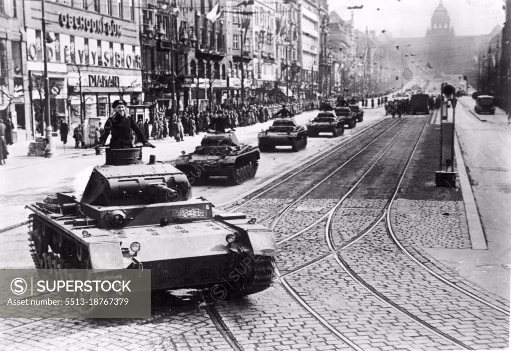 First German parade in Prague -- On Friday (17.3) took General Geyr von Schweppenburg on Wenceslas Square from the first parade dent chef troops in Prague. For half an hour the German tanks rolled all classes in fast ride down the Wenceslas Square. Aided by the good weather, lined a numerous crowd both sides of the square. The audience, which consisted mostly of Czechs was very impressed by the massive spectacle. March 18, 1939. (Photo by Atlantic Photo).