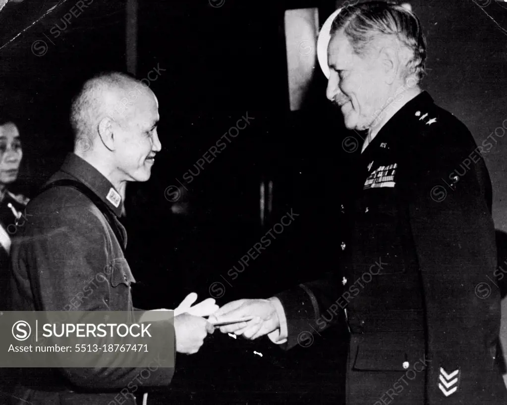 Generalissimo Greets American Ambassador -- American Ambassador to China Maj. Gen. Patrick J. Hurley (right) shakes hands with Generalissimo Chiang Kai-Shek after presenting his credentials at the Government House in Chungking. January 24, 1945. (Photo by Official Chinese Photo). 