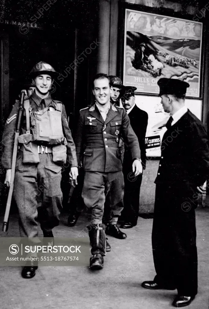 More German Visitors arrive in England -- "Season!" said this Nazi air officer in perfect English to the ticket-collector at the barrier when he arrived at a London station on his way to a war prisoners' camp. He had been shot down in the south east when on his way to London by air. September 06, 1940. (Photo by Central Press Photos Ltd.).