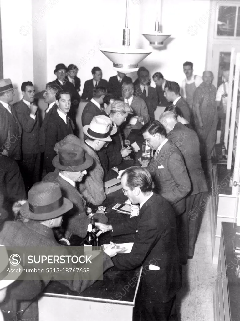 Mark Death Of Dry Era -- This is just part of the crowd that surged into Bloomingdale's, New York department store, December 5, to lay in a supply of wet goods as soon as the news became known that old man prohibition had died a more or less natural death. The new liquor regulations make department store selling of liquor one of the more interesting experiments of another "experiment to end experiments." May 12, 1933. (Photo by Associated Press Photo).