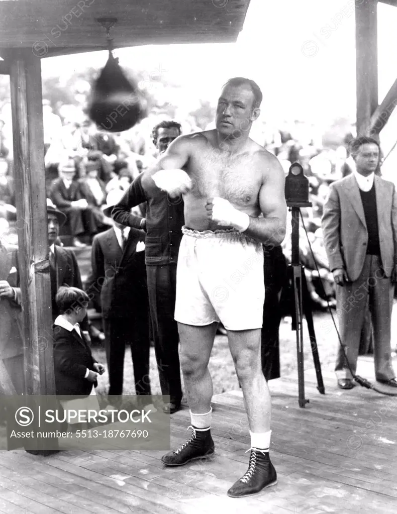 Preparing To Move Man MountainJack Sharkey punching the bag at Orangeburg, N.Y., where he is getting ready for his battle with Primo Carnera, Italian giant, in New York, June 29. June 14, 1933. (Photo by Associated Press Photo).