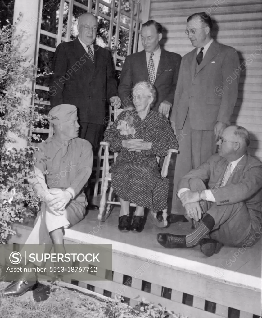 Family ReunionThe Eisenhower family enjoys a happy reunion with their famed son and brother, on the front porch of the general's mother's home in Abilene. Left to Right: (standing) Arthur, Earl and Milton Eisenhower, the General's brothers; (seated) General Dwight D. Eisenhower; Mrs. Ida Eisenhower, the General's mother; and Edgar Eisenhower, another brother. June 24, 1945. (Photo by ACME).