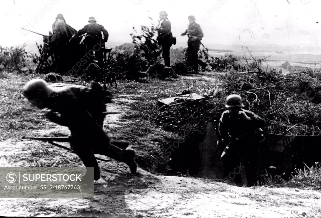 Latest - ***** Of Anti-Aircraft Section Or Germany's Siegfried Line -- Troops leaving a camouflaged dug-out, part of a fortified position on top of a hill. August 22, 1939. (Photo by Keystone).