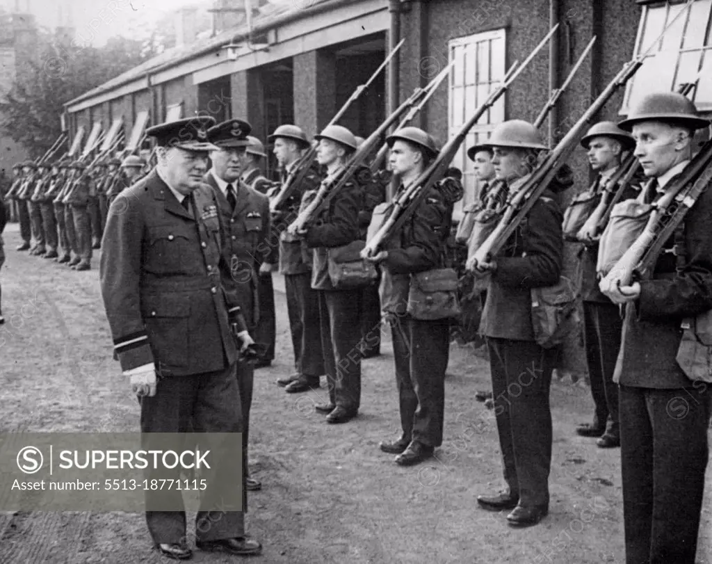 Air Commodore Churchill -- Inspected a R.A.F. guard of honour at the aerodrome.The Prime Minister wearing the uniform of Air Commodore of the Royal Air Force recently visited No. 615 Squadron of which he is honorary air commodore. He spent some time looking round the aerodrome and had tea with officers in the Mess. He was accompanied by Mrs. Churchill. September 30, 1941. (Photo by British Official Photograph).