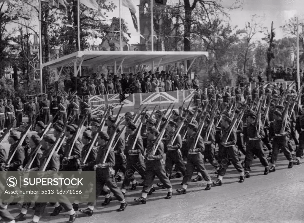 Mr. Churchill Takes Salute At Great Berlin Victory Parade - Men of the 7th Armoured division, the famous "Desert Rats" who fought their way through from El Alamein, march past the saluting base.Mr.Winston Churchill took the salute at a great British victory parade in the heart of Berlin. when 10,000 men from the fighting services merched along the charlottenburger Chaussee, the broad highway which cuts through Berlin's Tiergarten. July 23, 1945.