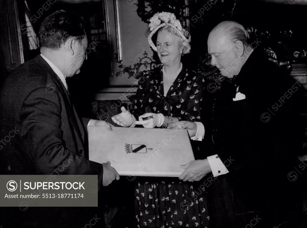 Mr.Winston Churchill, accompanied by Mrs. Churchill. received the diploma making him a Freeman of Strasbourg, from the Mayor of Starsbourg, M.Charles Frey (left) this month when he was attending meeting of the Council of Europe. August 25, 1949. (Photo by The Associated Press Ltd).