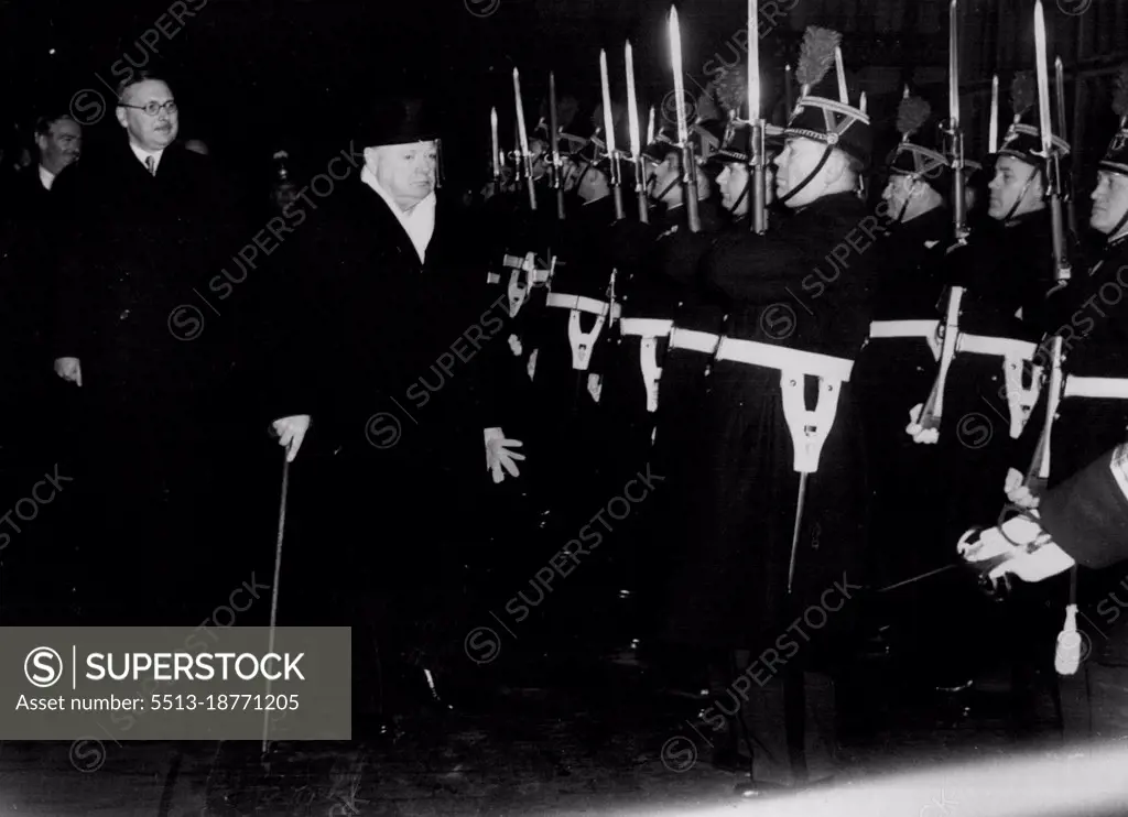 Churchill Arrives in Paris. Reviews Honour Guard. British Prime Minister Winston Churchill reviews the guard of honour at the railway station on arrival here.In the background, from left to right, are; Sir Oliver Harvey, British Ambassador to Paris; British Foreign Minister Anthony Eden, and French Premier Rene Pleven.Eden is accompanying Churchill on his visit to Paris. They are holding talks with French Ministers in preparation for the forthcoming Churchill visit to Truman in Washington next month. December 18, 1951.