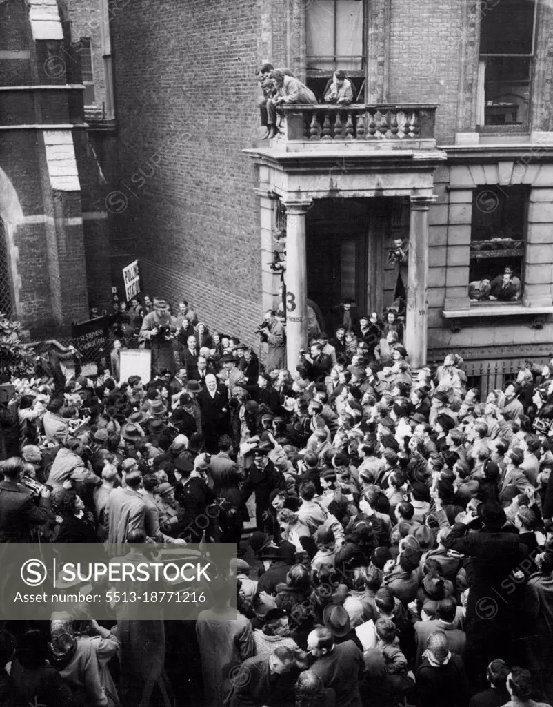 Churchill Leaves Polling Station - Cheered by Huge Crowds.Huge Crowds Churchill, cheering him as he leaves the polling station after casting his vote in the General Election today (Thursday). He an be seen between the two doorways.Mr. Churchill voted in St. Stephen's Church Hall, Emperor's Gate, Gloucester Road, London. October 25, 1951. (Photo by Reuterphoto).